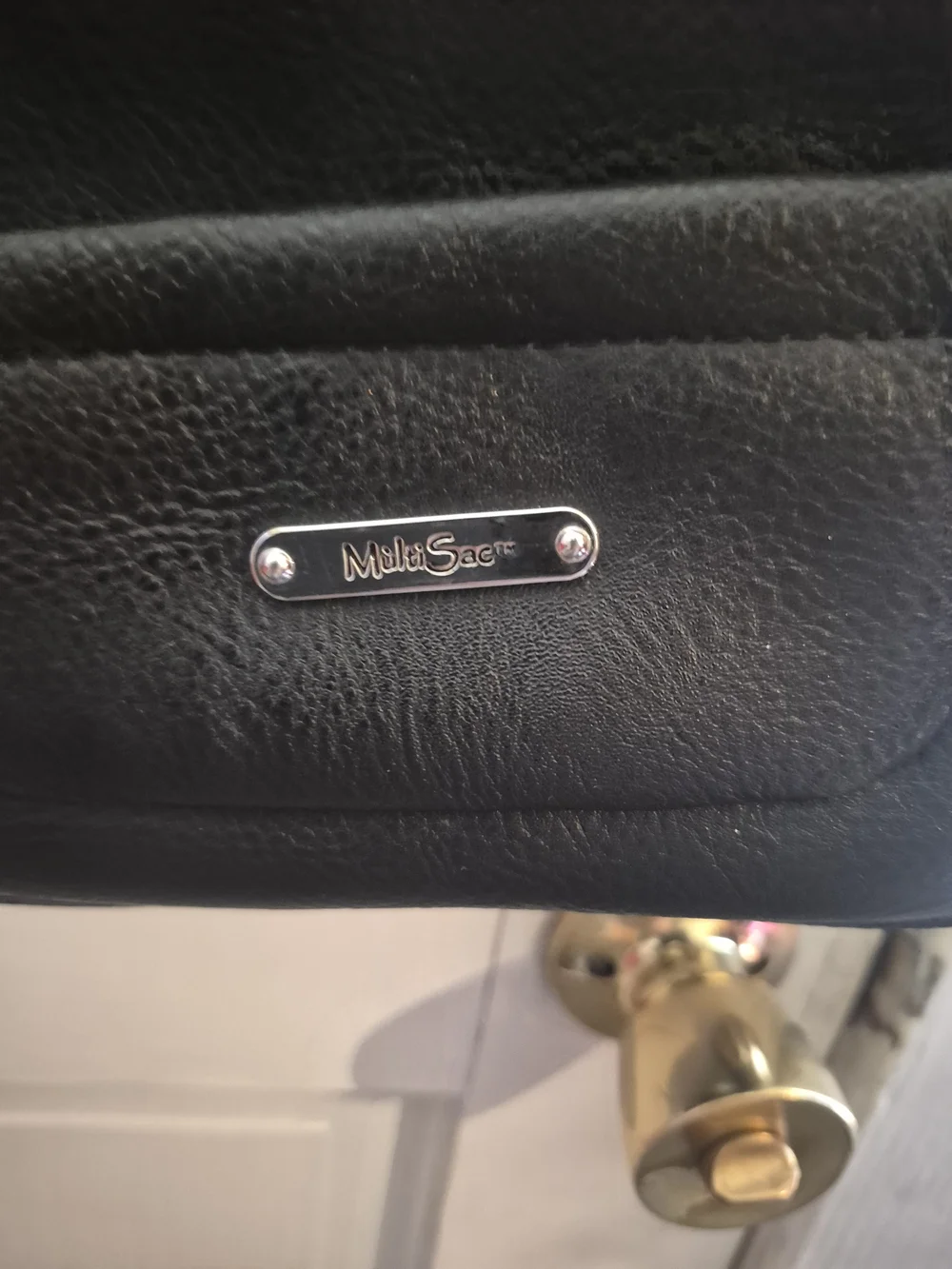 MultiSac Black Leather Crossbody Bag - Polished Logo Accent
